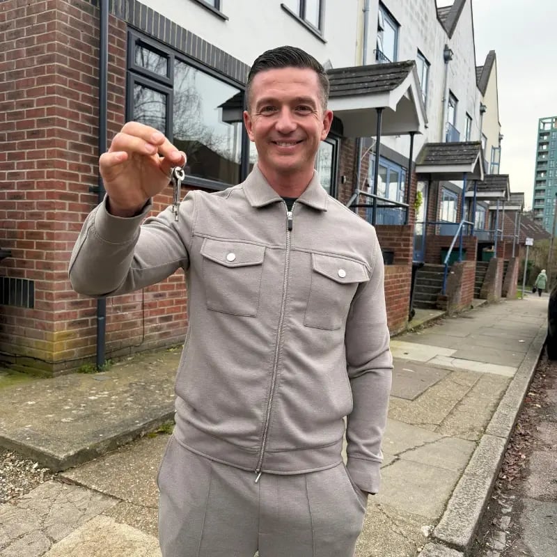 Steve Doran holding the keys to one of his HMO properties — the investment model that replaced his firefighter's salary